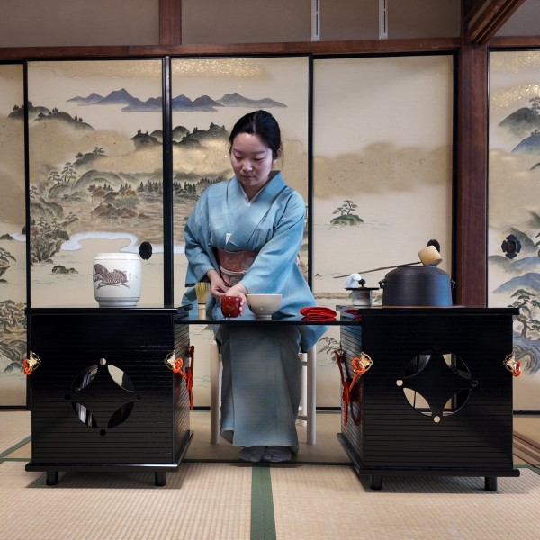 A lady serving tea