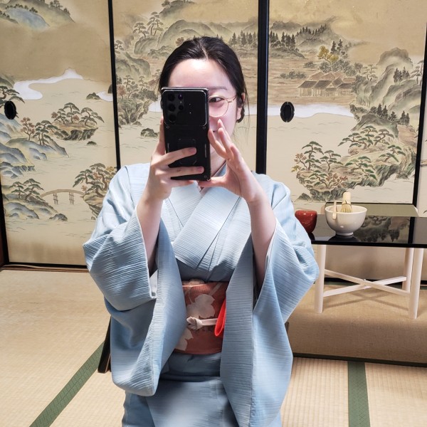 The tea ceremony lady taking a picture of us